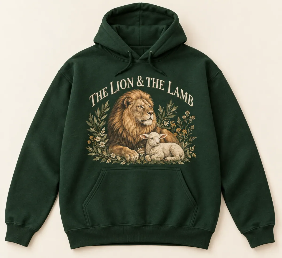 Forest Green hoodies. A peaceful lion and lamb resting together among olive leaves and wildflowers, with The Lion & The Lamb lettering.